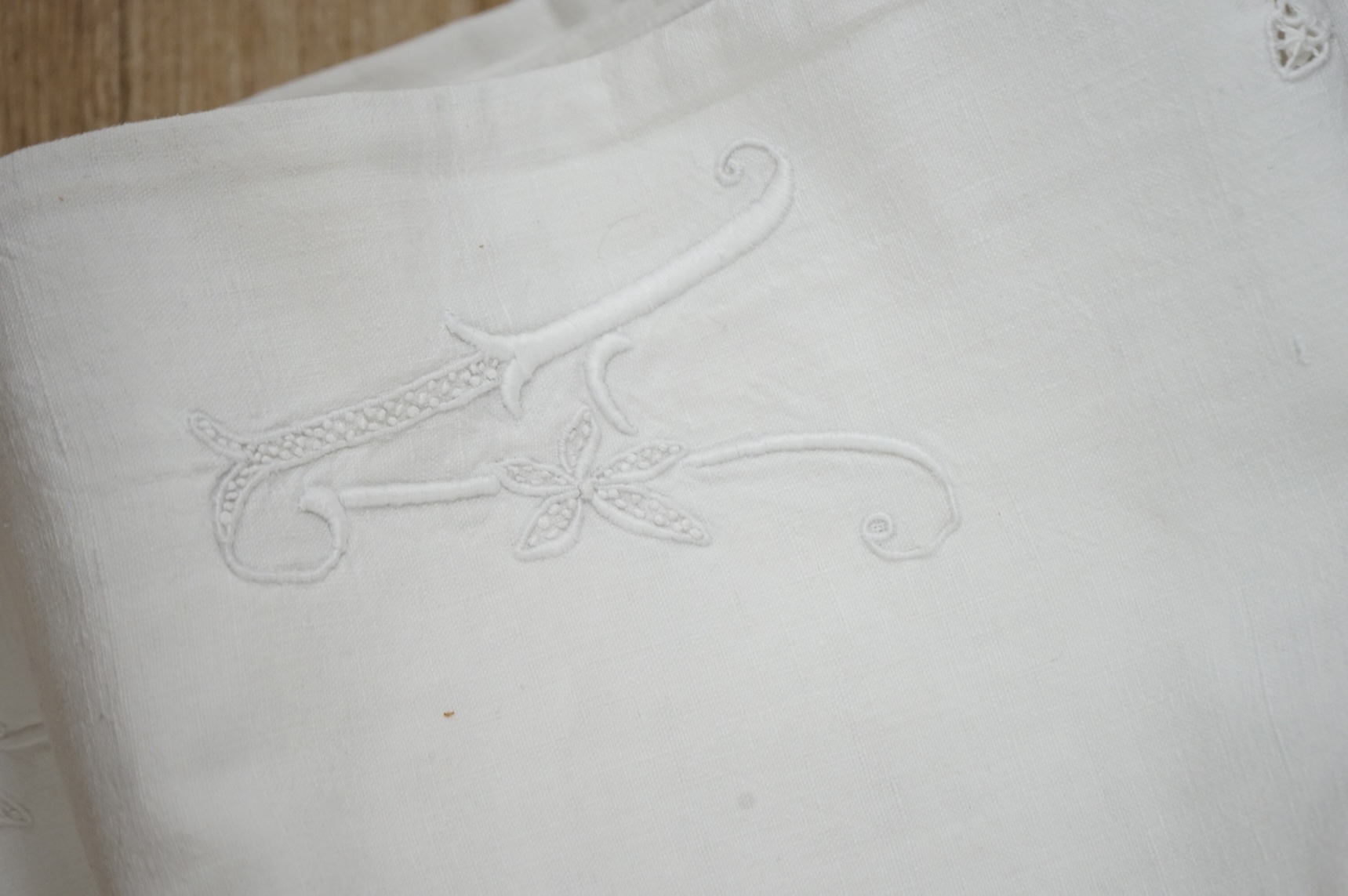 A French provincial linen sheet with lace edge and insertions plus a pair of similar sheets with drawn thread and monograms